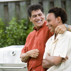 Hispanic father with African American teenage son