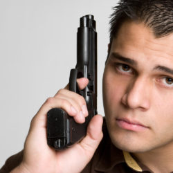 bigstock-Man-Holding-Gun-12035426