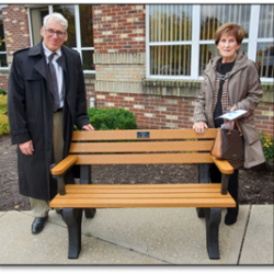 Eileen McLaughlin (right) dedicated a bench in memory of her two daughters who attend VMA - Cynthia McLaughlin VMA ’69 and Michele McLaughlin Suprunowicz ’74. Eileen’s son, Paul, joined her for the blessing.