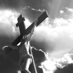 crucifixion of Jesus Christ with dramatic sky in background